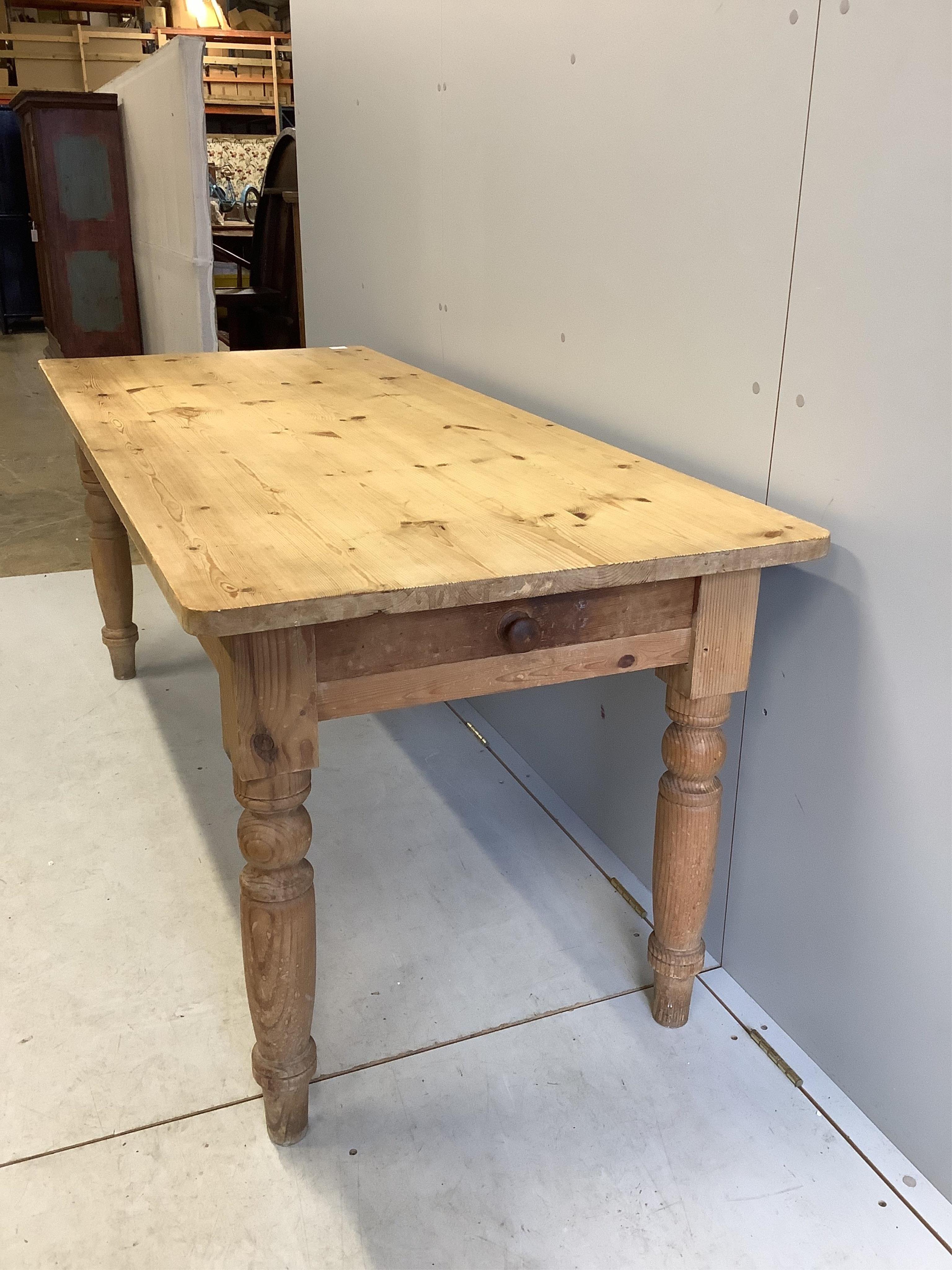 A Victorian style rectangular pine kitchen table, width 183cm, depth 76cm, height 76cm. Condition - fair to good